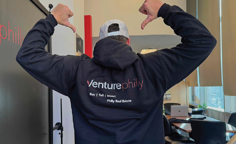 Real estate agent wearing a Venture Philly-branded hoodie